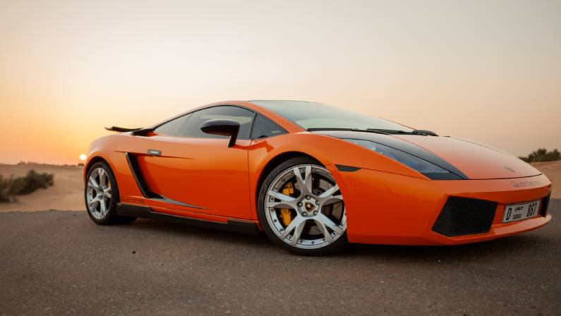 Lamborghini car on a sunset in desert