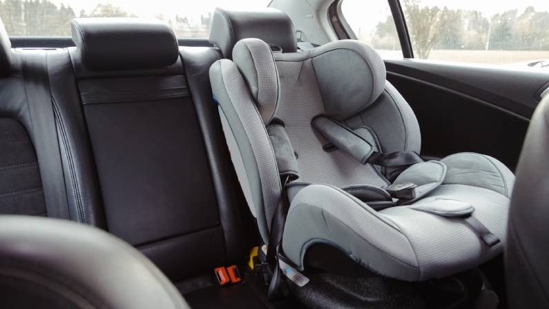 Child car seat for safety in the rear passenger seat of a car.